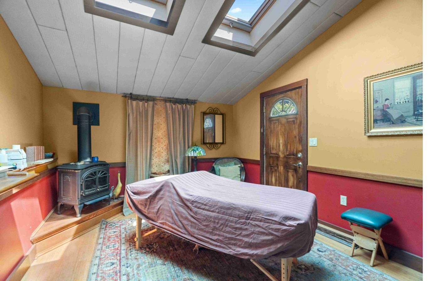 Treatment room with skylights and massage table