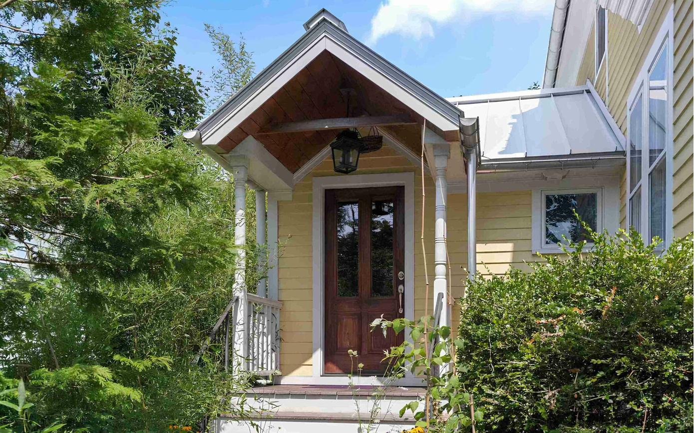 Building exterior — charming yellow Victorian